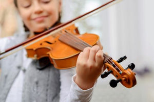 Happy girl playing violin
